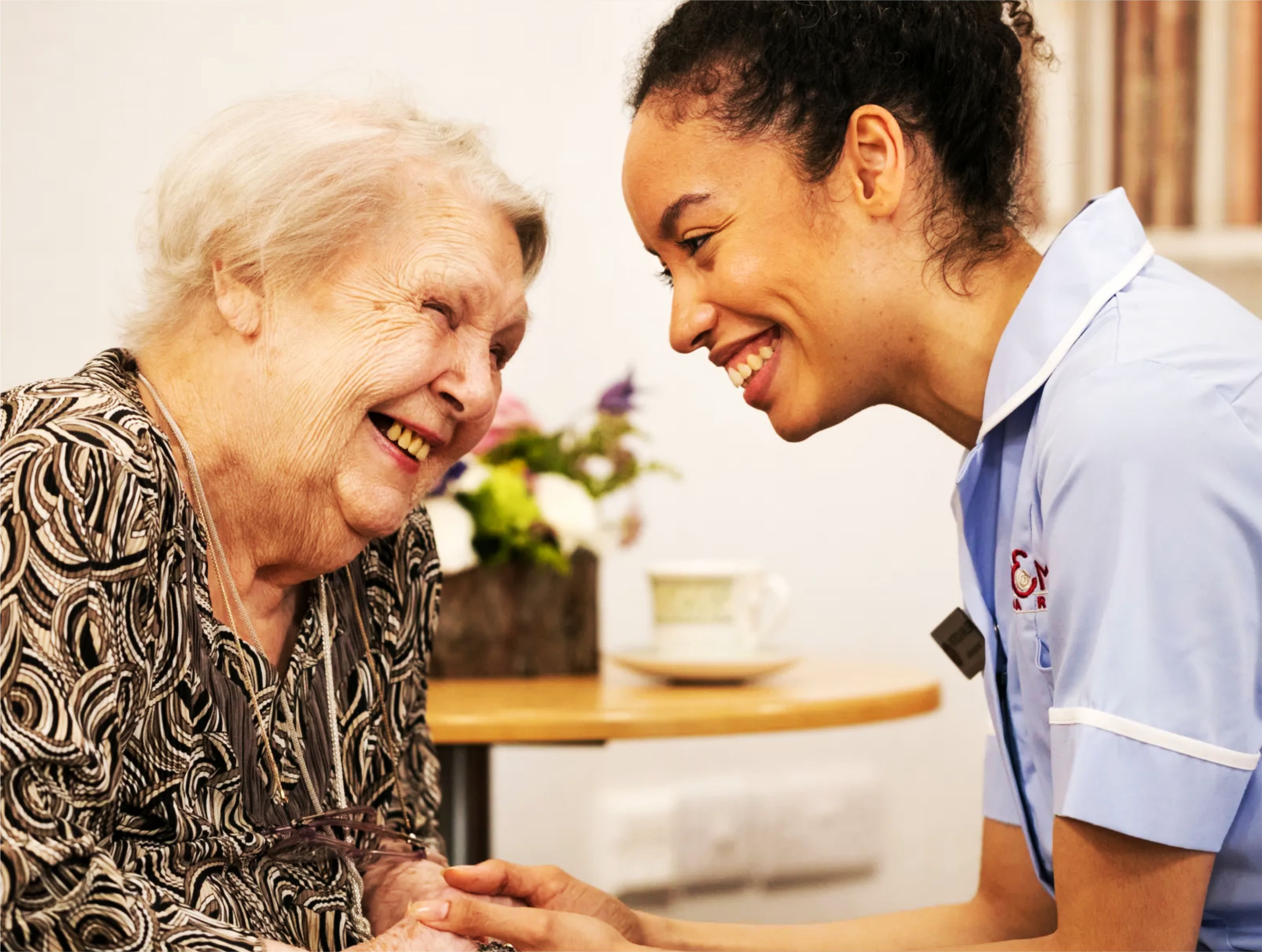 Senior enjoying gardening with carer